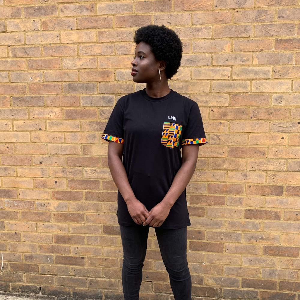 Afro woman in T-Shirt with Kente Print Pocket