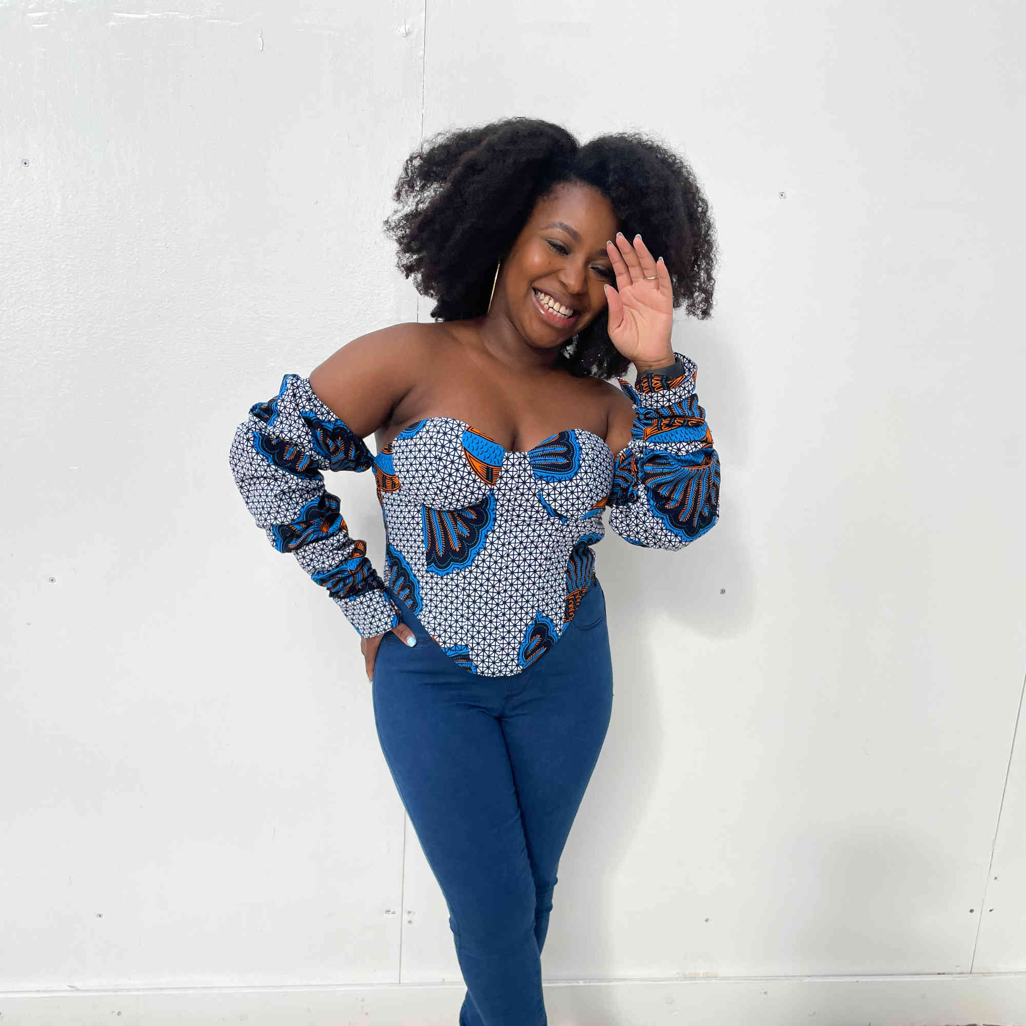 Model outfit in African print corset top