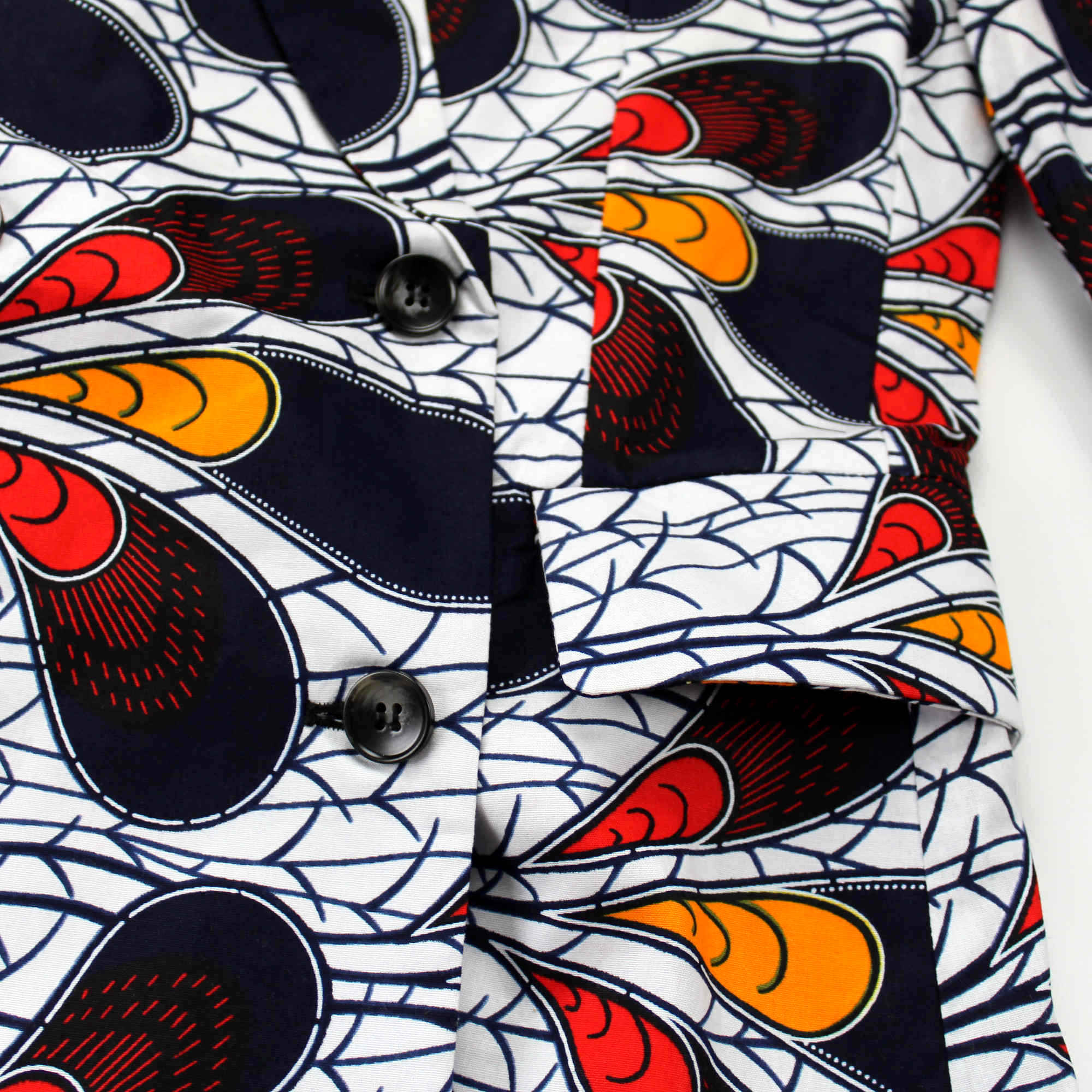 Detailed shot of African print blazer dress in white