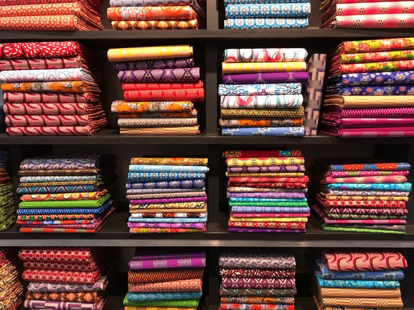 piles of african fabric