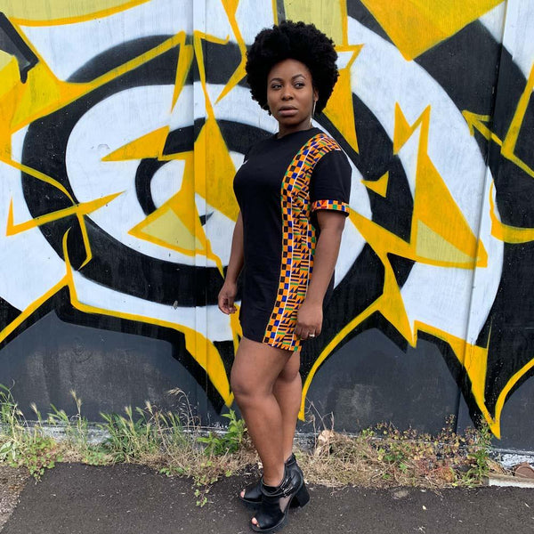 Afro woman in kente print shirt-dress